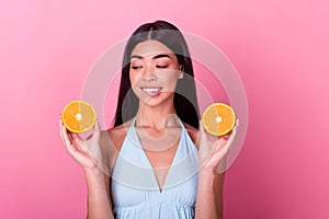 Photo of stunning lovely lady feel hungry bite lips want eat healthy mandarin slice isolated pastel color background