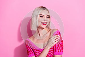 Photo of stunning positive person toothy smile hand touch bare shoulder flirt  on pink color background