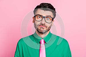 Photo of stupor confused guy wear green shirt spectacles looking you isolated pink color background