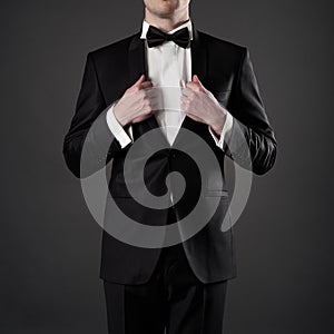 Photo of stylish man in elegant black suit