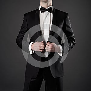 Photo of stylish man in elegant black suit