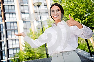 Photo of successful gorgeous lady in park dressed stylish white shirt glasses recommend buy rent comfort real estate