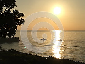 Photo of the sunset in the coastal town of Bacong