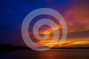 Sunset island with moody cloud and colorful sky photo