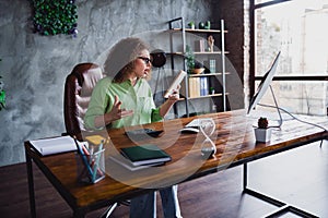 Photo of surprised amazed confused woman reading report plan weekly task in modern office workspace workstation