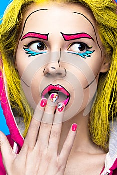 Photo of surprised young woman with professional comic pop art make-up and design manicure. Creative beauty style.