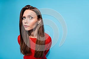 Photo of suspicious lady look distrustful on camera wear red knitted sweater isolated blue color background