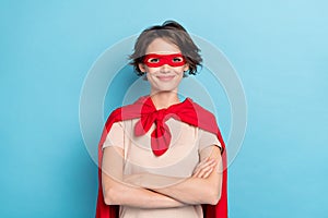 Photo of sweet adorable woman wear red cape smiling arms folded isolated blue color background