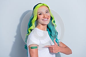 Photo of sweet cute vibrant gradient hair girl dressed t-shirt pointing corona virus sticky plaster isolated white color