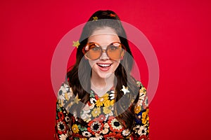 Photo of sweet impressed young lady dressed flower print outfit glasses open mouth isolated red color background