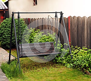Photo of swinging bench in a garden