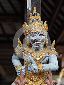 Detail of a painted statuette of Garuda, the half-man half-bird god in Bali, Idonesia photo