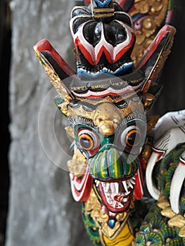 Detail of a painted statuette of Garuda the half-man half-bird in Bali, Indonesia photo