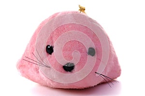 A photo taken on a cute pink seal sea lion plush toy