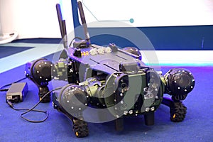 A quadruped military robot at rest position on display photo