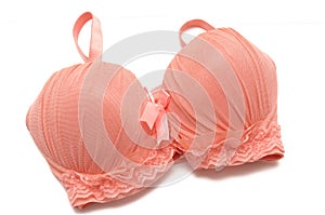 A lacy orange brassiere with shoulder straps photo