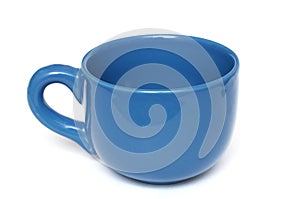 A large plain all blue coffee mug with handle