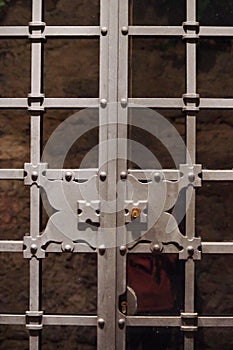 Detail of a medieval iron entrance gate, San Gimigniano in Tuscany - Italy photo