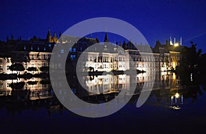 Photo taken at night of Dutch Parliament buildings.