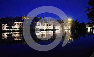 Photo taken at night of Dutch Parliament buildings.