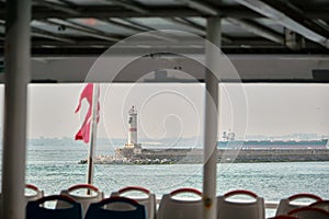 Photo taken from public transportation ferry in istanbul of Lighthouse in bosporus