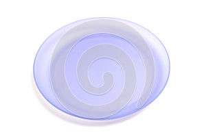 A single purple plastic plate isolated against a white backdrop