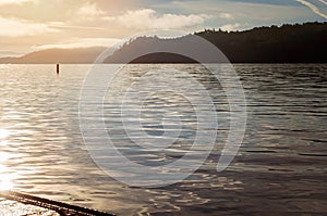 Sun Rising at Clear Lake, Lake County California, With Lake View and Mountains photo