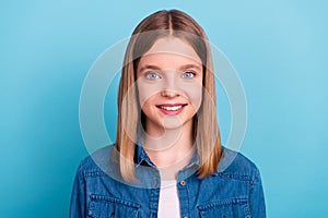 Photo of teenager blond girl wear jeans jacket isolated on blue color background