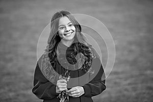 photo of teenager girl smile with fall flowers. teenager girl with fall flowers outdoor.