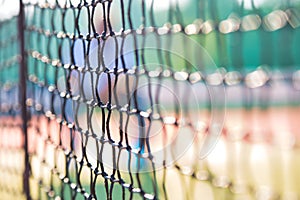 Photo of tennis net at court