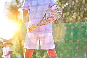 Photo of tennis net at court with yellow lens flare