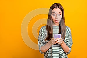 Photo of terrified feared girl having perhaps read message about her being fired while isolated with yellow background