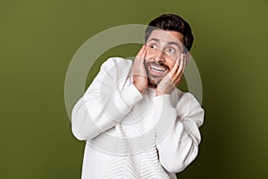 Photo of terrified frightened man wear stylish clothes watching empty space news isolated on khaki color background