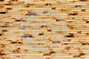 Photo texture of brown and yellow colored bamboo mat