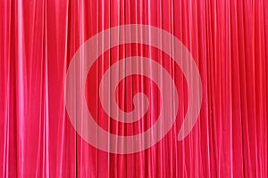Photo Theatrical curtain of scarlet color of velvet.