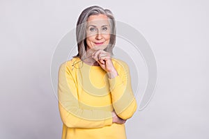 Photo of thoughtful minded beautiful positive mature woman thinking brainstorming isolated on grey color background