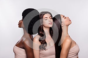 Photo of three attractive girls cosmetology bodycare perfect dreamy enjoy treatment isolated over grey color background