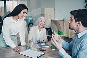 Photo of three business people have meeting man discuss explain report in modern office