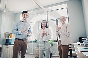 Photo of three business people support clapping hands in modern office