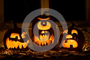 Photo of three pumpkins for Halloween.