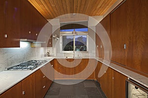 Timber interior of small residential kitchen photo