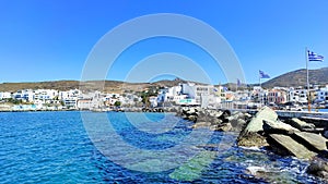 Photo of Tinos, a gorgeous Cycladic island in Greece, and its scenic harbor.