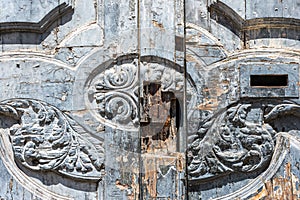 photo of a torn lock from an old dried-out carved door