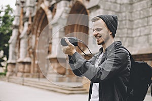 The photo of a tourist that likes to take pictures of city landscapes