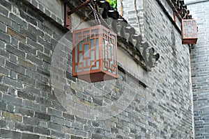 traditional Chinese style lantern hanging on old brick wall