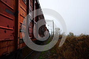 Photo of the train on rainy cloudy weather with shallow depth of fiel