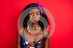 Photo of tricky childish wavy dark skin lady wear pin up outfit bloated cheeks  red color background