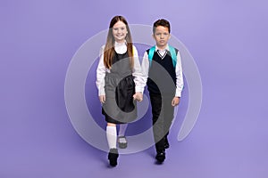 Photo of two best buddies schoolkids go school lesson with backpacks isolated purple color background