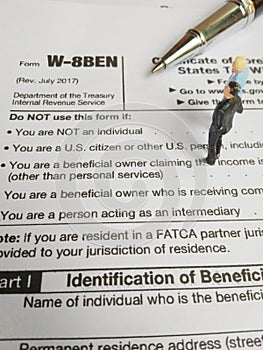 Two businessman discussion about usa tax form, w-8ben, certificate of foreign status of beneficial owner for united states tax wit