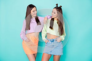 Photo of two cheerful lady best friends cool youth look clothes talking communicating wear cropped sweaters pullovers